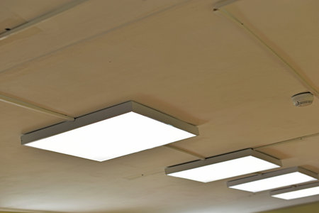 Square white lamp on the ceiling in the office