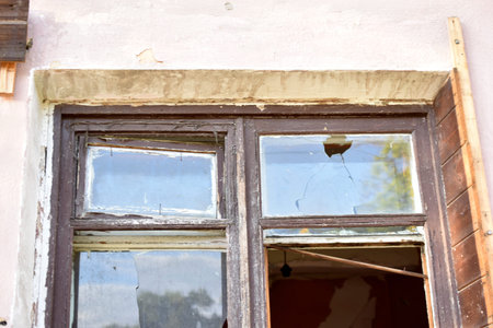 The window in the house is broken glass hooliganism.