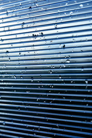 Raindrops on the glass blue polycarbonate surfaceの写真素材