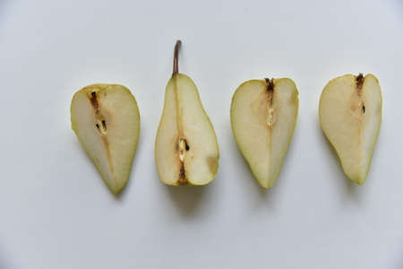 Sliced green pear in half on a white background. nature background.の写真素材