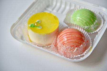 Colorful sugar cheesecakes cake on white background.Illustration on colorful.