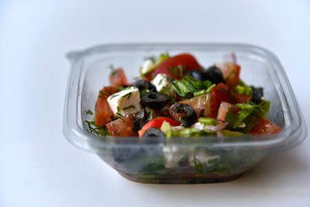 Caesar salad with chicken and white suluguni cheese.Healthy eating. fast food.の写真素材