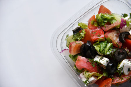 Caesar salad with chicken and white suluguni cheese.Healthy eating. fast food.の写真素材