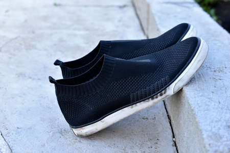 Light summer black boots on a gray background. travel fashion.の写真素材