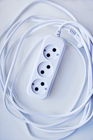 White electric extension cord, great design for any purpose. white background. network extension...