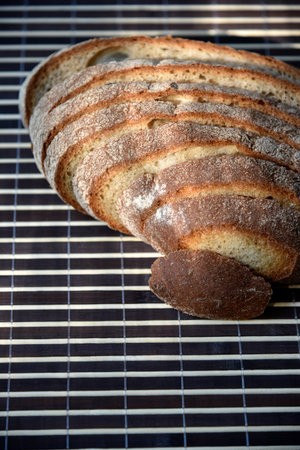 Sliced rye delicious bread on a mat. Lunch bread close-up. Vegetarian food.