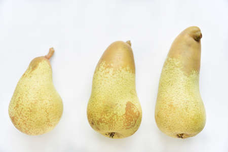 Fresh delicious yellow pears on a white background. healthy eating.の写真素材