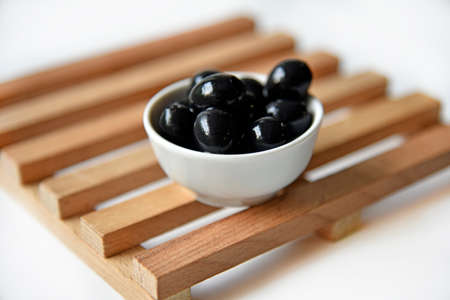 Black delicious fresh olives in a saucepan. Vegetarian food. healthy eating.の写真素材