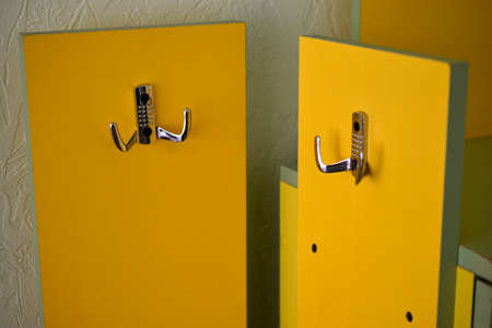Yellow hanger indoors at home with silver handles. home decor.の写真素材