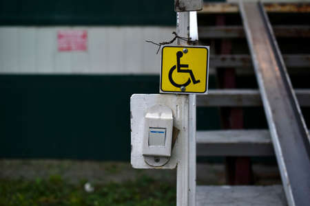 An inclusive approach to the building and the disabled sign. A call to call for assistance to the disabled.の写真素材