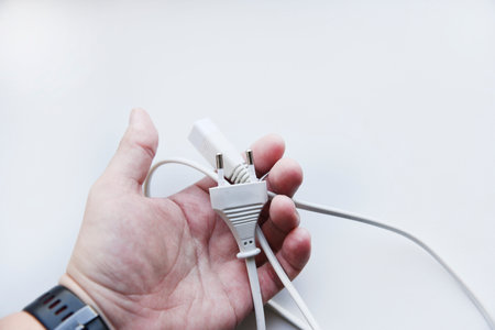 White power cord on a white background. Electric cord on a white background.