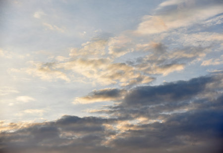 Sunset sky with pink and blue clouds in summer. Beautiful sunset with the sun.Beautiful wallpaper.の写真素材