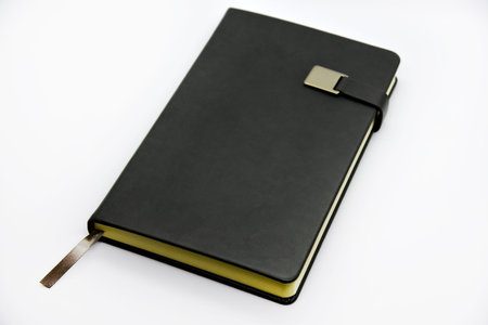 Gray leather notebook on a white background. Notebook close-up.