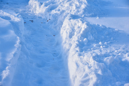 A snow path in a field in winter. White snow path.Holiday celebration. natural beauty.