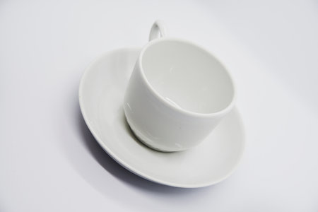 Tea couple on a white background. Porcelain service close-up. A teacup and saucer.の写真素材
