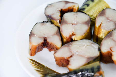 Cold smoked fish on a white plate. Delicious herring. smoked herring.の写真素材