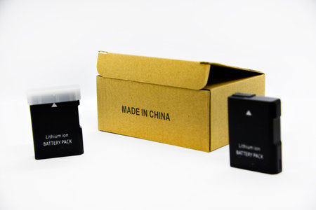 Lithium rechargeable battery from the camera. Battery for the device on a white background. Analog and original of the battery.の写真素材