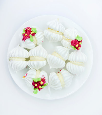 Delicious bizet marshmallows on a white plate. A sweet snack. Marshmallows for tea.の写真素材