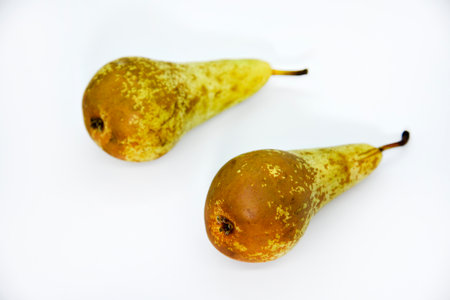 Delicious green pear on a plate. Pear close-up. A whole pearl.の写真素材