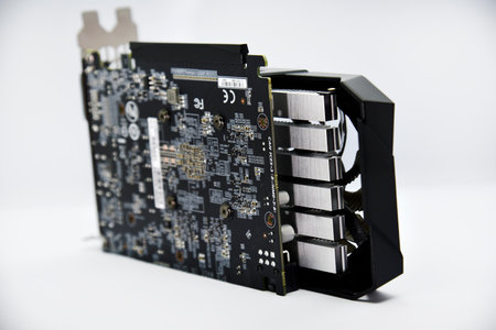 A video game card with two fans. A tool for mining. Accessories for a personal computer. Black graphics card on a white background.のeditorial素材