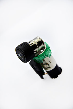 Cigarette lighter with green backlight. Spare part for the car. The electric cigarette lighter is disassembled.の写真素材