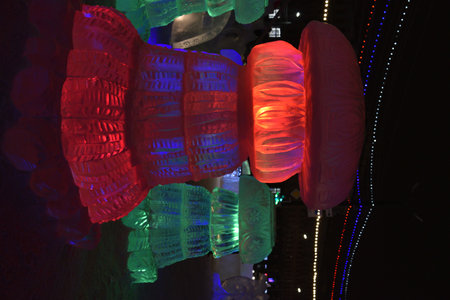 Chelyabinsk, Ural Russia - 01 03 2023: Ice sculptures on Revolution Square in Chelyabinsk in the new year. Beautiful illuminations and a Christmas tree. administrative buildings.のeditorial素材