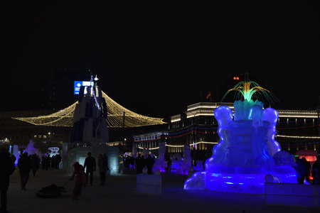 Chelyabinsk, Ural Russia - 01 03 2023: Ice sculptures on Revolution Square in Chelyabinsk in the new year. Beautiful illuminations and a Christmas tree. administrative buildings.のeditorial素材