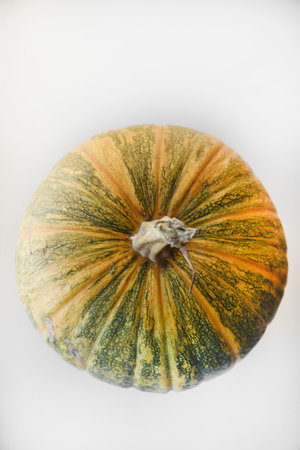 Yellow-green pumpkin on the windowsill. A large pumpkin on a white background.の写真素材