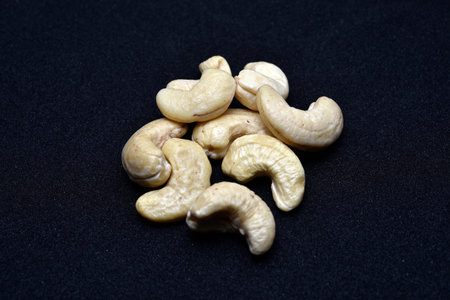 cashew nuts on black background. close-up of cashew nutsの写真素材