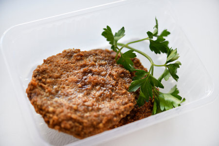 Two meat patties on a white plate. Meat breakfast.の写真素材