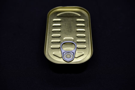 Canned food on a black background. top view. copyspace.