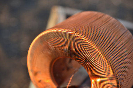 Copper coil. Copper wire wound on a coil. Copper scrap.の写真素材