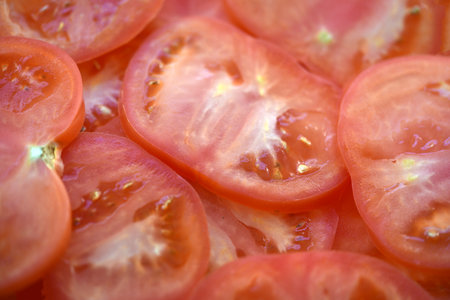 Juicy red tomatoes Sliced tomatoes into slices.の写真素材