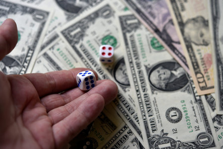 Dollar bills and dice. financial games. Speculation.