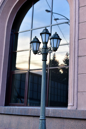 Square decorative street lights on a window background. Beautiful street lights in the city.