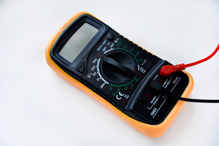 Multimeter on a white background. voltage and current meter.