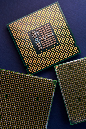 A computer processor on a blue background. Contacts on the processor case.