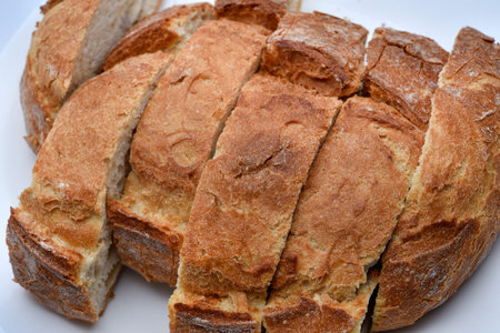 Fresh crusty bread. Sliced bread on a plate. Sandwiches.