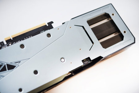 The case of the video card on a white background. A device for a computer. The radiator of the video...
