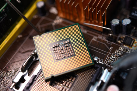 Microprocessor and socket on the motherboard. Computer radio components. Microchips and chips.