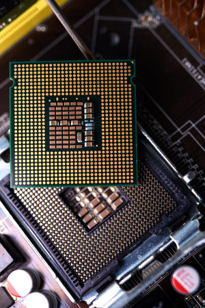 Microprocessor and socket on the motherboard. Computer radio components. Microchips and chips.