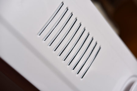 The panel of the white heater. Cracks in the radiator.