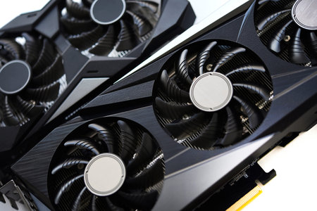 A black and white video card on a white background. Fans and the graphics card case. Computer...