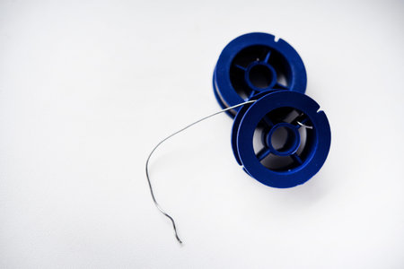 Tin-lead solder in coils on a white background. Materials for soldering.