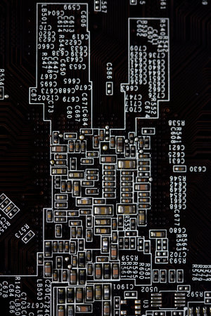 A brown printed circuit board with resistors and capacitors. An electronic board with radio...