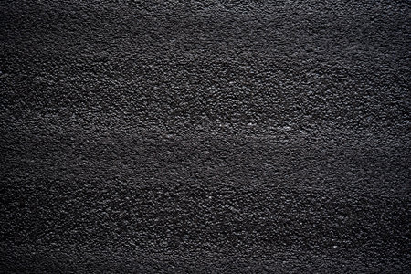 Black porous porous foam background. Background texture of black foam rubberの写真素材