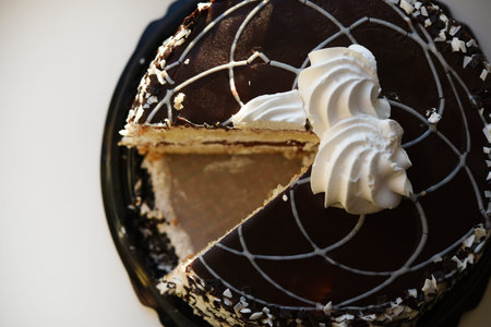Sliced chocolate cake. Sweet cake with filling.