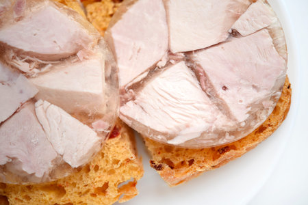 Sausage sandwiches on a white plate. A brawn with meat.