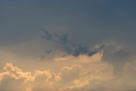 Evening cumulus clouds in the light of the sun.