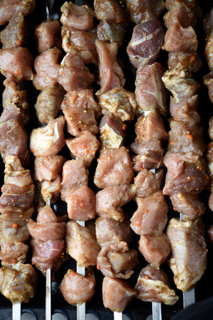 Raw pickled pork meat. Prepared for frying shish kebab.の写真素材